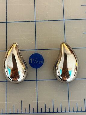 Large silver coloured teardrop earrings